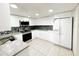 Modern kitchen with stainless steel appliances and white cabinetry at 2109 Morning Dr, Orlando, FL 32809