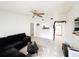 Spacious living room with sectional sofa and tile floors at 2109 Morning Dr, Orlando, FL 32809