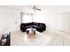 Living room with dark sectional sofa and a coffee table at 2109 Morning Dr, Orlando, FL 32809