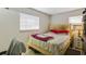 Cozy guest bedroom with a comfortable bed and nightstand at 2225 Cindy Cir, Orlando, FL 32818