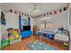 Charming bedroom with playful decor and plenty of storage at 2460 Oak Mill Dr, Kissimmee, FL 34744
