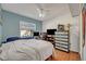 Bright bedroom with a comfortable bed and plenty of space for a workspace at 2460 Oak Mill Dr, Kissimmee, FL 34744