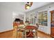 Cozy dining area with a round table and view into the living room at 2460 Oak Mill Dr, Kissimmee, FL 34744