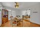 Bright dining room features a round table set and view into the living room at 2460 Oak Mill Dr, Kissimmee, FL 34744