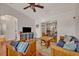 Living room with wooden armchairs and a sofa at 2460 Oak Mill Dr, Kissimmee, FL 34744