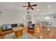 Bright living room features a comfy couch and tile floors at 2460 Oak Mill Dr, Kissimmee, FL 34744
