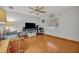 Home office with a large TV, desk and tiled floors at 2460 Oak Mill Dr, Kissimmee, FL 34744