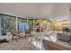 Relaxing screened patio with outdoor furniture and pizza oven at 2460 Oak Mill Dr, Kissimmee, FL 34744
