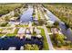 Aerial view of waterfront community with houses and canals at 26603 W Cove Dr, Tavares, FL 32778