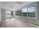 Living area with multiple windows offering backyard access and water views at 26603 W Cove Dr, Tavares, FL 32778