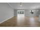 Spacious living room with light gray walls and wood floors at 26603 W Cove Dr, Tavares, FL 32778