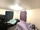Bedroom with two beds and a large TV at 30 E Ella J Gilmore St, Apopka, FL 32703