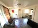 Living room with laminate flooring and a dining area at 30 E Ella J Gilmore St, Apopka, FL 32703