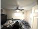 Main bedroom with a ceiling fan and window at 30 E Ella J Gilmore St, Apopka, FL 32703
