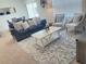 Spacious living area with comfortable seating and rug at 310 Gardenia Ct, Poinciana, FL 34759