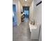 Bright and airy entryway with tile floors and bench at 310 Gardenia Ct, Poinciana, FL 34759