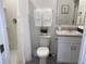 Clean bathroom with a toilet, sink, and shower at 310 Gardenia Ct, Poinciana, FL 34759