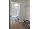 Bathroom with shower and walk-in closet at 310 Gardenia Ct, Poinciana, FL 34759