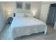 Spacious bedroom with a king-size bed and ensuite bathroom at 310 Gardenia Ct, Poinciana, FL 34759