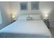 King-size bed in bright and airy bedroom with ample space at 310 Gardenia Ct, Poinciana, FL 34759