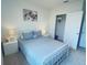 Light and airy bedroom with a queen-size bed and closet at 310 Gardenia Ct, Poinciana, FL 34759
