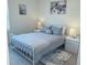 Cozy bedroom featuring a queen-size bed and stylish decor at 310 Gardenia Ct, Poinciana, FL 34759