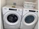 Laundry room with Whirlpool washer and dryer at 310 Gardenia Ct, Poinciana, FL 34759
