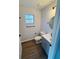 Clean bathroom with gray vanity and vinyl plank flooring at 4171 Radford Rd, Bartow, FL 33830