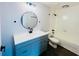 Updated bathroom with gray vanity, white fixtures, and a bathtub at 4171 Radford Rd, Bartow, FL 33830