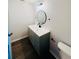 Modern bathroom with gray vanity and floating shelves at 4171 Radford Rd, Bartow, FL 33830