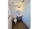 Simple bathroom with gray vanity and vinyl plank flooring at 4171 Radford Rd, Bartow, FL 33830