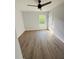 Bright bedroom with ceiling fan and vinyl plank flooring at 4171 Radford Rd, Bartow, FL 33830