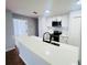 Updated kitchen featuring white cabinets, stainless steel appliances, and a quartz countertop at 4171 Radford Rd, Bartow, FL 33830