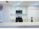 Newly remodeled kitchen with white shaker cabinets and stainless steel appliances at 4171 Radford Rd, Bartow, FL 33830