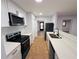 Bright kitchen with white cabinets and tile floors at 4171 Radford Rd, Bartow, FL 33830