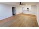 Spacious living area with wood-look flooring and a ceiling fan at 4171 Radford Rd, Bartow, FL 33830