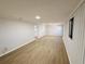 Open living room with wood-look floors and neutral wall tones at 4171 Radford Rd, Bartow, FL 33830