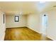 Large living room showcasing wood-look flooring and updated walls at 4171 Radford Rd, Bartow, FL 33830