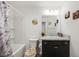 Small bathroom with a shower/tub combo and updated vanity at 4694 Monica St, The Villages, FL 32163