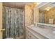 Bathroom with marble vanity and floral shower curtain at 701 Greentree Ct, Lake Mary, FL 32746