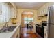 Galley kitchen with stainless steel appliances and ample counter space at 701 Greentree Ct, Lake Mary, FL 32746