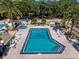 Community pool with surrounding patio and lounge chairs at 701 Greentree Ct, Lake Mary, FL 32746