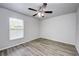 Bedroom featuring wood-look floors and a ceiling fan at 1261 Sherbrook Dr, Deltona, FL 32725