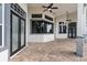 Spacious covered patio with paver stones, offering multiple access points to the house at 12927 Magnolia Pointe Blvd, Clermont, FL 34711