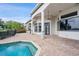 Large back patio with pavers, adjacent to pool at 12927 Magnolia Pointe Blvd, Clermont, FL 34711