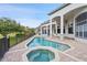 Large pool and spa with plenty of patio space at 12927 Magnolia Pointe Blvd, Clermont, FL 34711