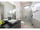 Modern bathroom with a glass shower and floating vanity at 15144 Pendio Dr, Montverde, FL 34756