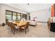 Elegant dining area with a view of the living room and pool at 15144 Pendio Dr, Montverde, FL 34756
