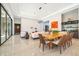 Modern dining room with a unique wooden table and ample seating at 15144 Pendio Dr, Montverde, FL 34756