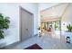 Bright and spacious entryway with tile floors and view into the living area at 15144 Pendio Dr, Montverde, FL 34756